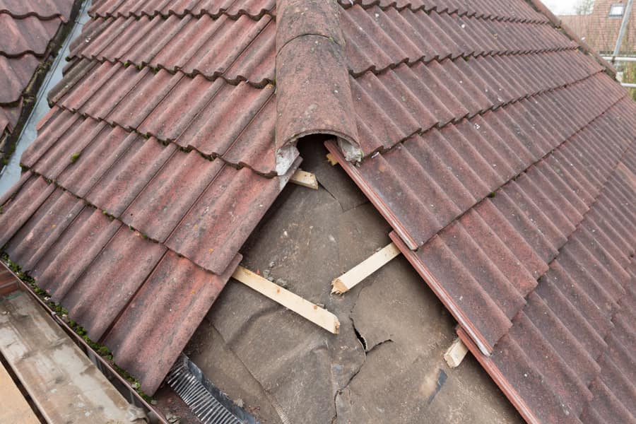 Roof repair replacing slipped tiles