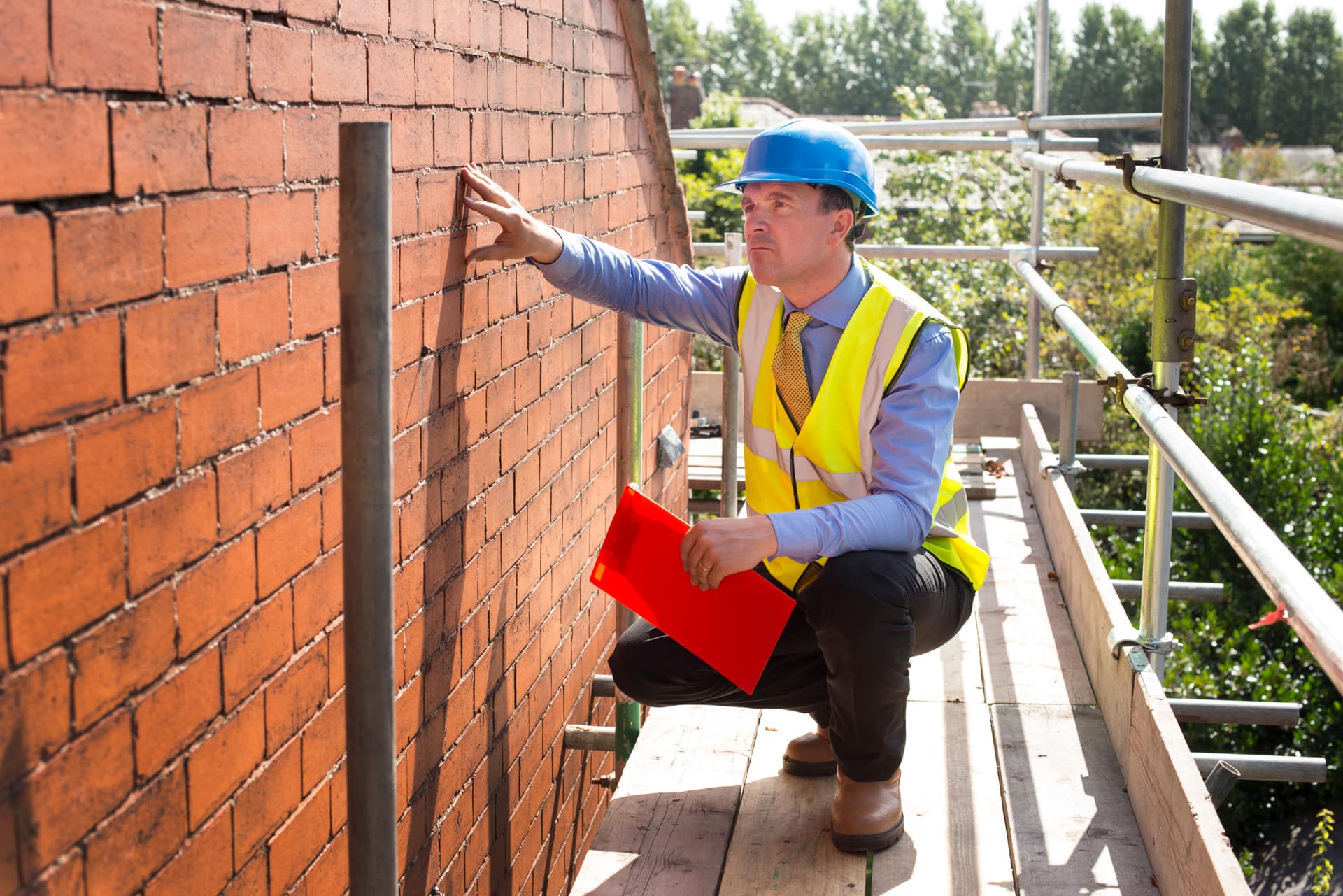 Roofer inspecting a roof